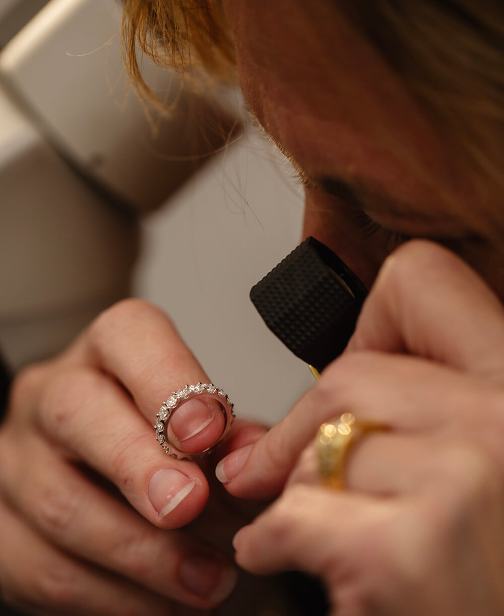 Expert appraising jewellery
